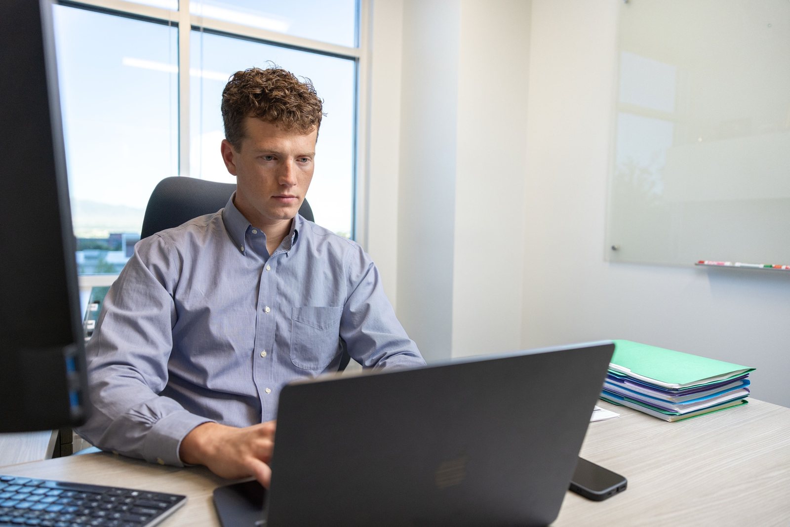 Matthew working through a client's books
