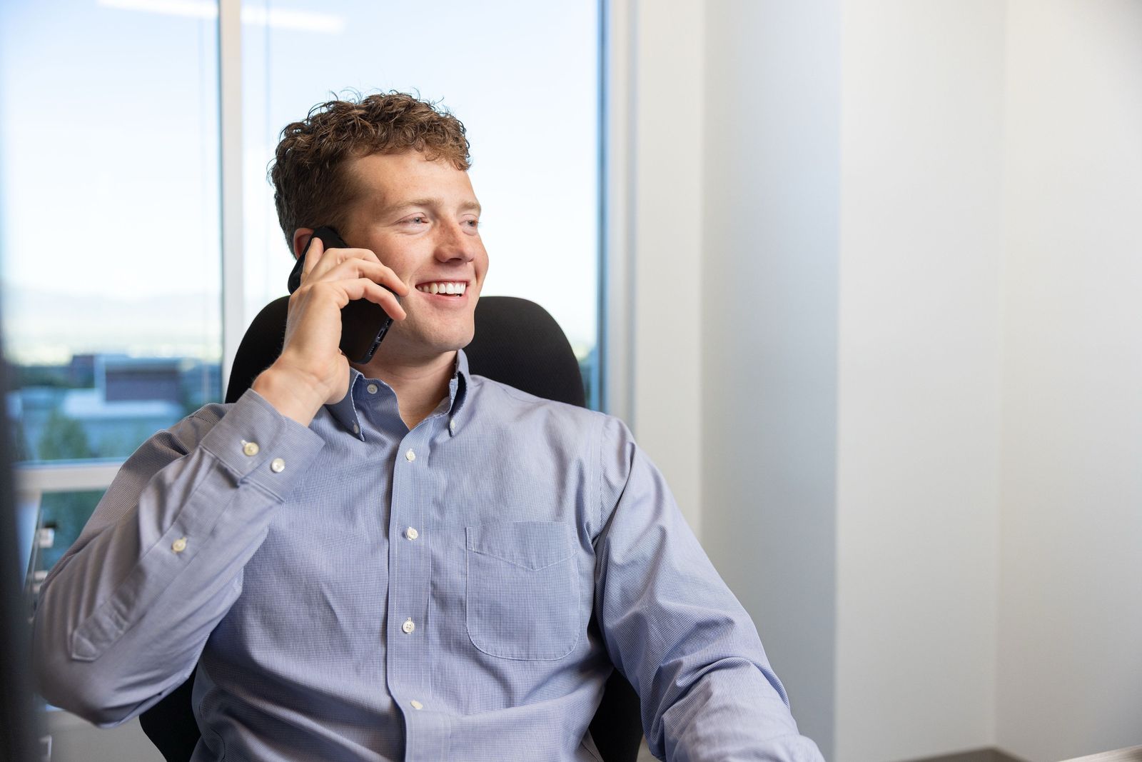 Matthew Gottfredson on the phone with a client in his Utah office